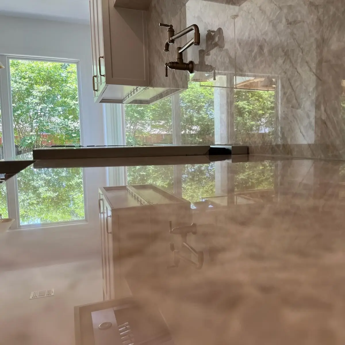 natural stone cleaning sample of marble counter and backsplash