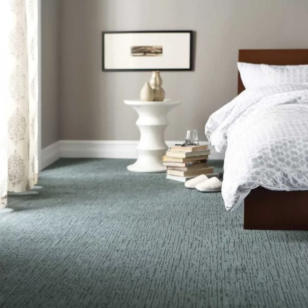 master bedroom with carpet and white bedding